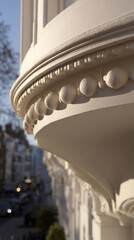 entablature. Classical architecture cornice featuring conical guttae details under soft window light. real-estate listings.
