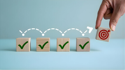 A sequence of four wooden blocks arranged in a row showcasing moving to success.