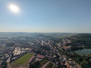 Obraz premium Aerial panorama of Polna city center with historic castle complex in Bohemia, showing preserved urban layout, architectural heritage, and surrounding landscape of a Czech historic town