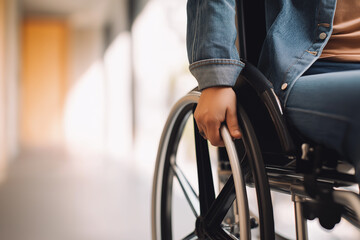 Obraz premium Youthful Wheelchair Movement, Young Individual Navigates Corridor Independently With Purpose, Young Person In Casual Attire Advances Wheelchair Along Corridor Demonstrating Independence And Resolve