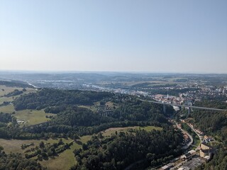 Obraz premium Aerial panorama of a highway bridge spanning over the town of Velke Mezirici, showing major transport infrastructure, urban landscape, and regional connectivity in the Vysocina region