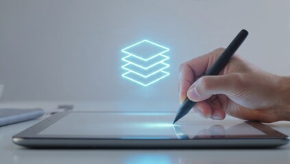 Graphic designer's hand using stylus on tablet with glowing layer icon digital design software concept creative workspace
