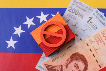 Fototapeta premium The cargo container embargo on the Venezuela flag as a backdrop for your design