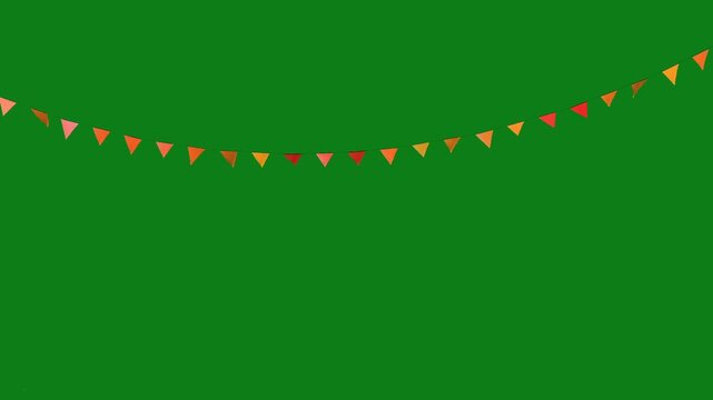 Vibrant triangular flags on string against green background for party decoration