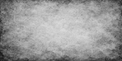 Fototapeta premium Aged dark grey grunge paper texture background featuring a rough vintage pattern with a dirty stone and concrete surface design for a weathered blank wallpaper