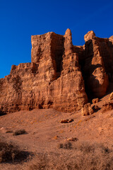 Fototapeta premium Charyn Canyon, Valley of Castles. The excellence of Kazakhstan. Panorama of natural unusual landscape. The red canyon of extraordinary beauty looks like a Martian landscape.