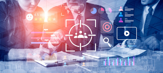 Business professionals engage in a collaborative meeting in a contemporary office while utilizing...