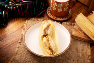 Tamales. Traditional dish typical of Mexico and some Latin American countries. Corn dough wrapped in corn leaves. The tamales are steamed.