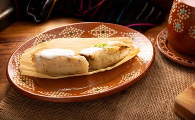 Tamales. Traditional dish typical of Mexico and some Latin American countries. Corn dough wrapped in corn leaves. The tamales are steamed.