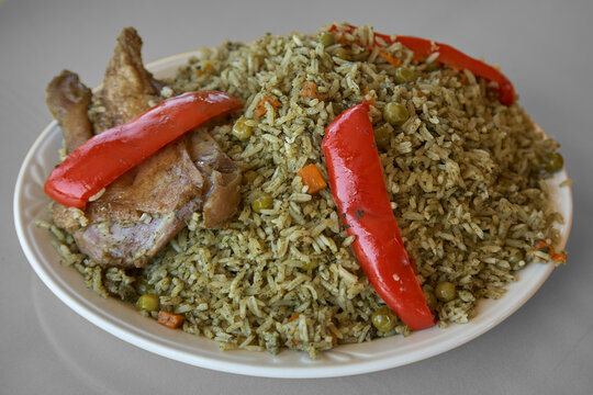 Arroz con Pato (Duck with Rice), a legendary dish that defines the culinary heritage of Lambayeque and the northern coast of Peru. Often considered the northern cousin of arroz con pollo