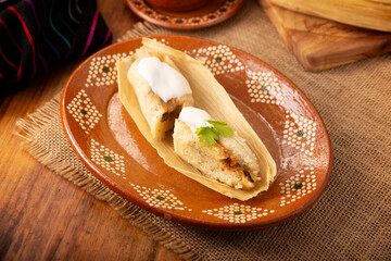 Tamales. Traditional dish typical of Mexico and some Latin American countries. Corn dough wrapped in corn leaves. The tamales are steamed.