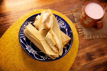 Tamales. Traditional dish typical of Mexico and some Latin American countries. Corn dough wrapped in corn leaves. The tamales are steamed.