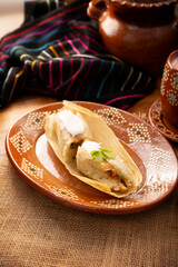 Tamales. Traditional dish typical of Mexico and some Latin American countries. Corn dough wrapped in corn leaves. The tamales are steamed.