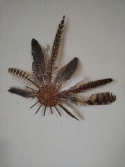 The original dream catcher made of feathers and the bottom of a basket