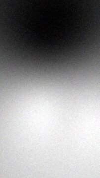 Abstract Black White Grain Gradient Animation Background. 9-16 Vertical Video Ratio suitable for Social Media. Loop Animation 