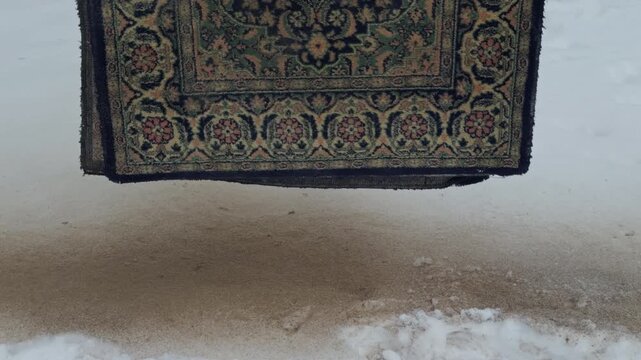 Decorative cloth draped over rugged floor surrounded by muted colors and textured surfaces