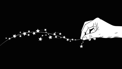 Hand holding a string of glowing star lights.