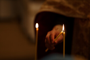 Orthodox Priest Lighting Candle During Child Baptism