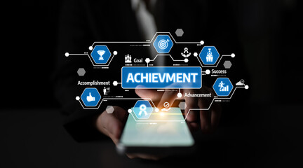 Fototapeta premium A businessman interacts with a smartphone displaying digital icons symbolizing achievement and success, illustrating modern business strategies and goals. Tessel