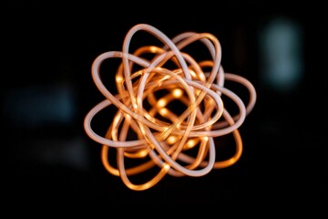 Light design forms a colorful metal shape in dark space