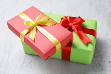 Obraz premium Bright gift boxes on grey textured table, closeup