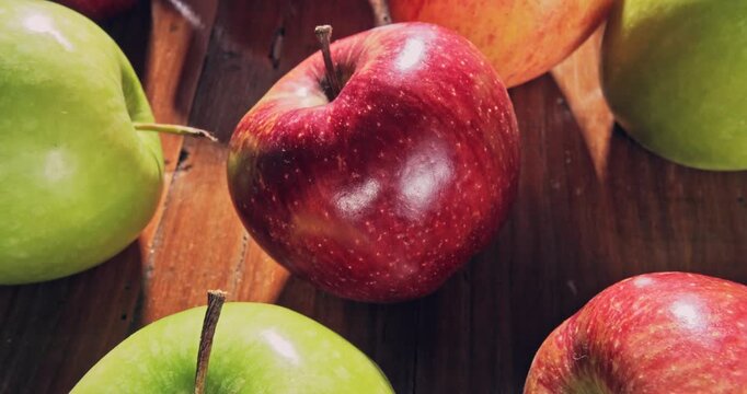 Overhead view, tour view of red and green apples on a natural surface.