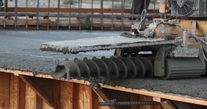 Bidwell smoothes concrete on bridge construction.