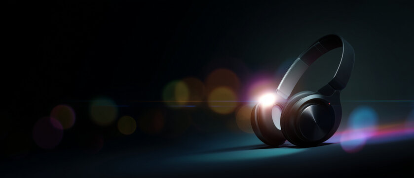 banner of over-ear headphones on a dark studio background with colorful light glow and floating particles, headphones placed on the left third, large clean copy space on the right