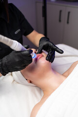 Close-up of cosmetology hardware treatment focused on healthy glowing skin and anti-aging care.