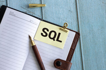 Businessman is using tablet pc and selecting sql.