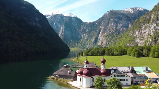 Aerial view of St. Bartholomew's pilgrimage church onLake K&ouml;nigssee with Watzman mountain backdrop in Bavrian Alps