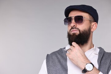 Obraz premium Man with mustache and beard on light grey background. Space for text