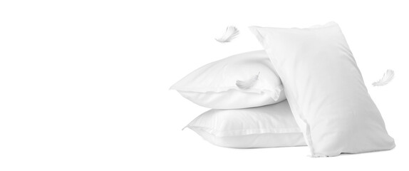 Naklejka premium Pillows and flying feathers on white background, poster design with space for text. Soft and comfort sleep