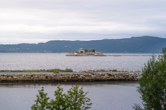 Munkholmen islet in Trondheimsfjorden Norway served many purposes such as monastery, fortress, prison and a World War II anti-aircraft gun station. Today it attracts visitors for its history and views