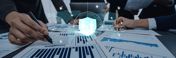 Business team engages in financial analysis with a focus on digital security concepts, showcasing collaboration and strategic planning in a modern workspace. Trope