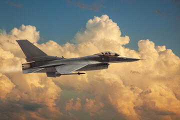 F-16 Flying Falcon jet model flies among dramatic clouds on a sunny day © Daniel Thornberg