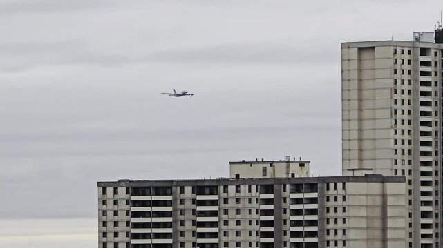 Airbus A380 Superjumbo Taking Off and Climbing Into Cloudy Sky After Departure