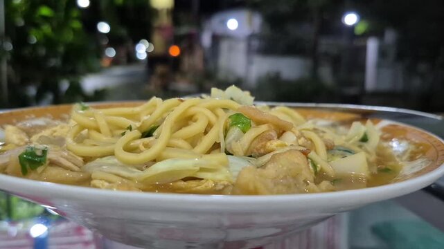 a portion of warm Javanese noodles served when the weather outside is raining