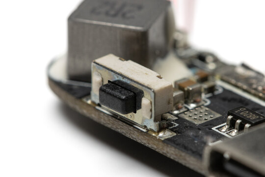 close up view of a micro switch on electronic circuit board. isolated on white background.