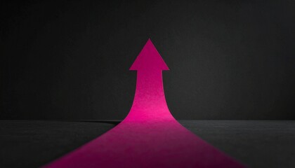 Fototapeta premium Bright magenta arrow pointing upwards on a dark background, symbolizing growth and success