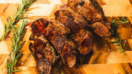 Sliced boneless lamb leg arranged on a wooden board, crispy outside and juicy inside. Beautifully presented, tender, and ready to serve for gatherings and special meals. © Lucastep