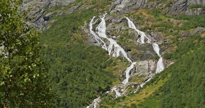 Scenic briksdal glacier waterfall in norway's famous landscape