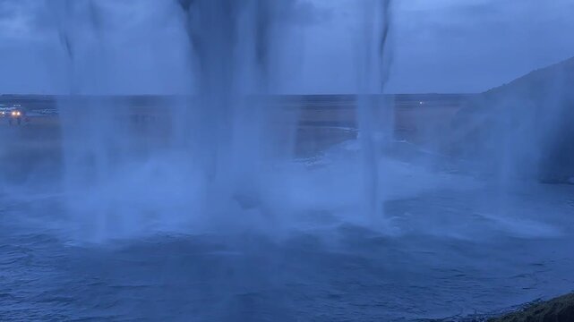 Static Shot Behind Seljalandsfoss Waterfall in Winter, Blue Hour, Iceland.