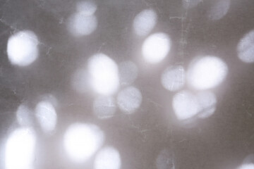 texture background of cracked white wax paper with atmospheric lights and shadows