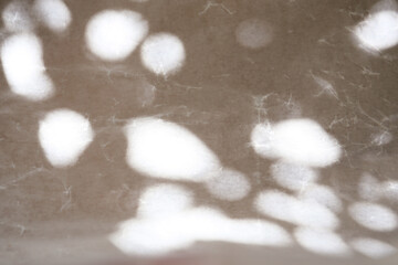 texture background of cracked white wax paper with atmospheric lights and shadows