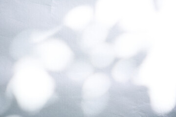 texture background of cracked white wax paper with atmospheric lights and shadows