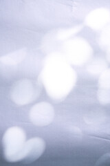 texture background of cracked white wax paper with atmospheric lights and shadows