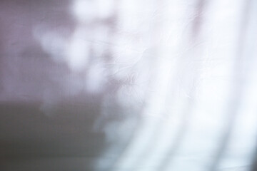 texture background of cracked white wax paper with atmospheric lights and shadows