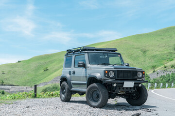 Driving spot, car parked on the plateau of the driving route