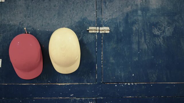 Colored helmets in a factory that are hung up on a wall. Dallas, Texas.